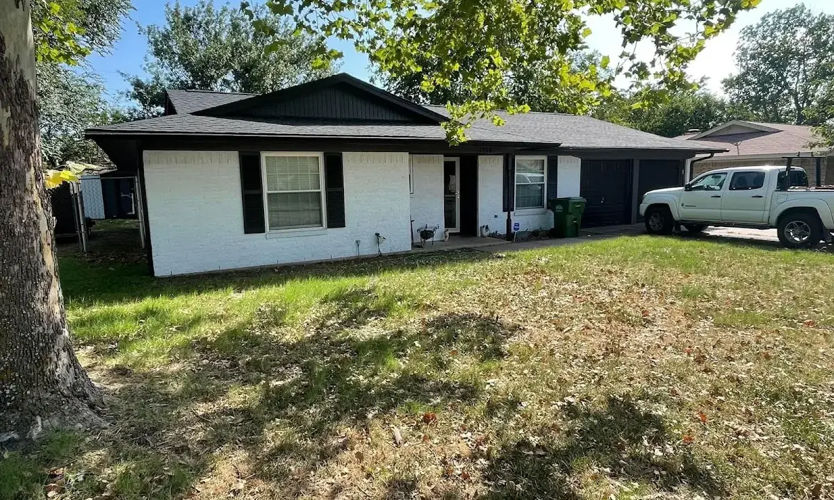 Professional roofing crew working on a residential roof in McHenry